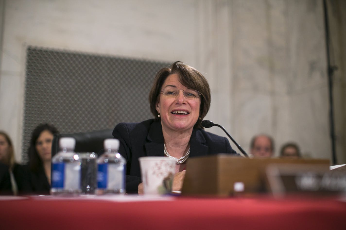 Sen. Amy Klobuchar (D-Minn.) speaks while Sen. Jeff Sessions (R-Ala.), President-elect Donald Trump&#xed;s pick for attorney general, gives testimony during the Senate Judiciary Committee hearing for Sessions' confirmation on Capitol Hill, in Washington, Jan. 10, 2017. (Al Drago/The New York Times)