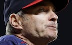 Minnesota Twins manager Paul Molitor stands in the dugout in the seventh inning of a baseball game against the Baltimore Orioles in Baltimore, Monday,