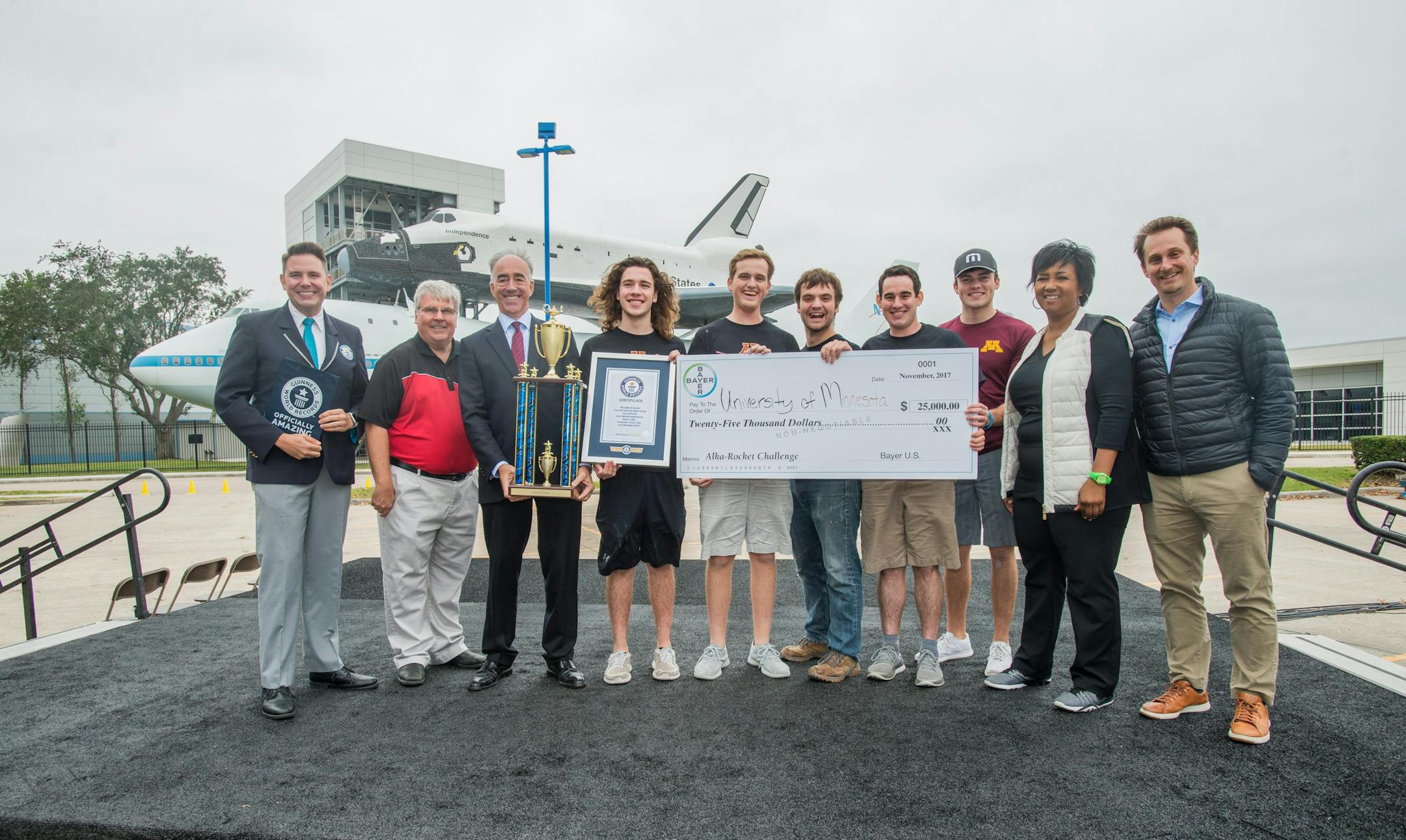 University of Minnesota students accept the winning prize in the Bayer-Big Ten Alka-Rocket Challenge at Space Center Houston.
