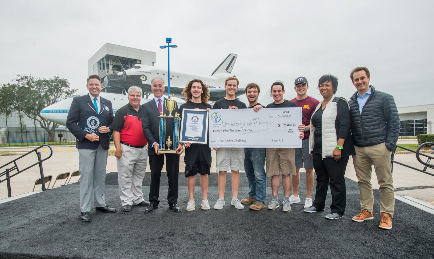 University of Minnesota students accept the winning prize in the Bayer-Big Ten Alka-Rocket Challenge at Space Center Houston.