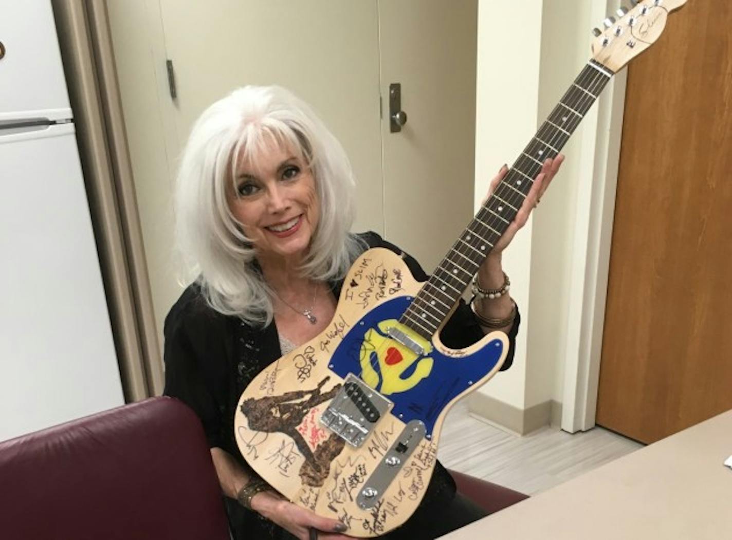 Emmylou Harris was among the 95 musicians to sign Mike Lancial's guitar to benefit Slim Dunlap. / Photo by Lori Lancial