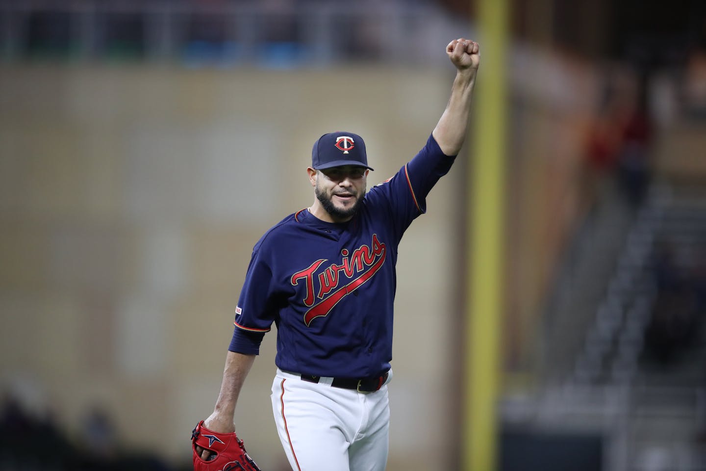 Twins starting pitcher Martin Perez celebrates getting the last out in the eighth inning