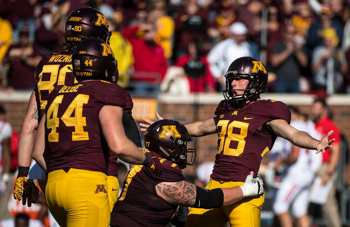 Teammates celebrated with Gophers kicker Emmit Carpenter (38) after his game-winning 28-yard field goal with 10 seconds remaining Saturday against Rutgers. ] (AARON LAVINSKY/STAR TRIBUNE) aaron.lavinsky@startribune.com The University of Minnesota Golden Gophers football team played the Rutgers Scarlet Knights on Saturday, Oct. 21, 2016 at TCF Bank Stadium in Minneapolis, Minn.