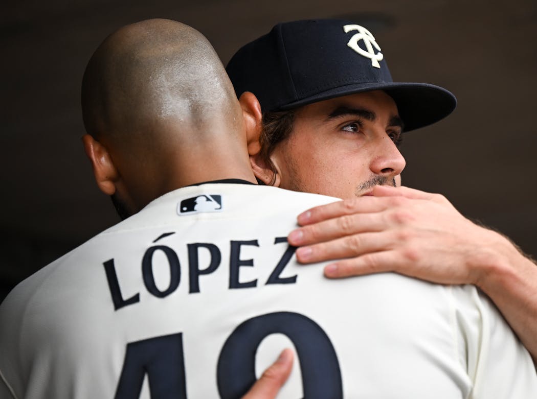 Twins pitchers Joe Ryan and Pablo López embraced after López completed the eighth inning vs. the Mets on Sept. 10 at Target Field.