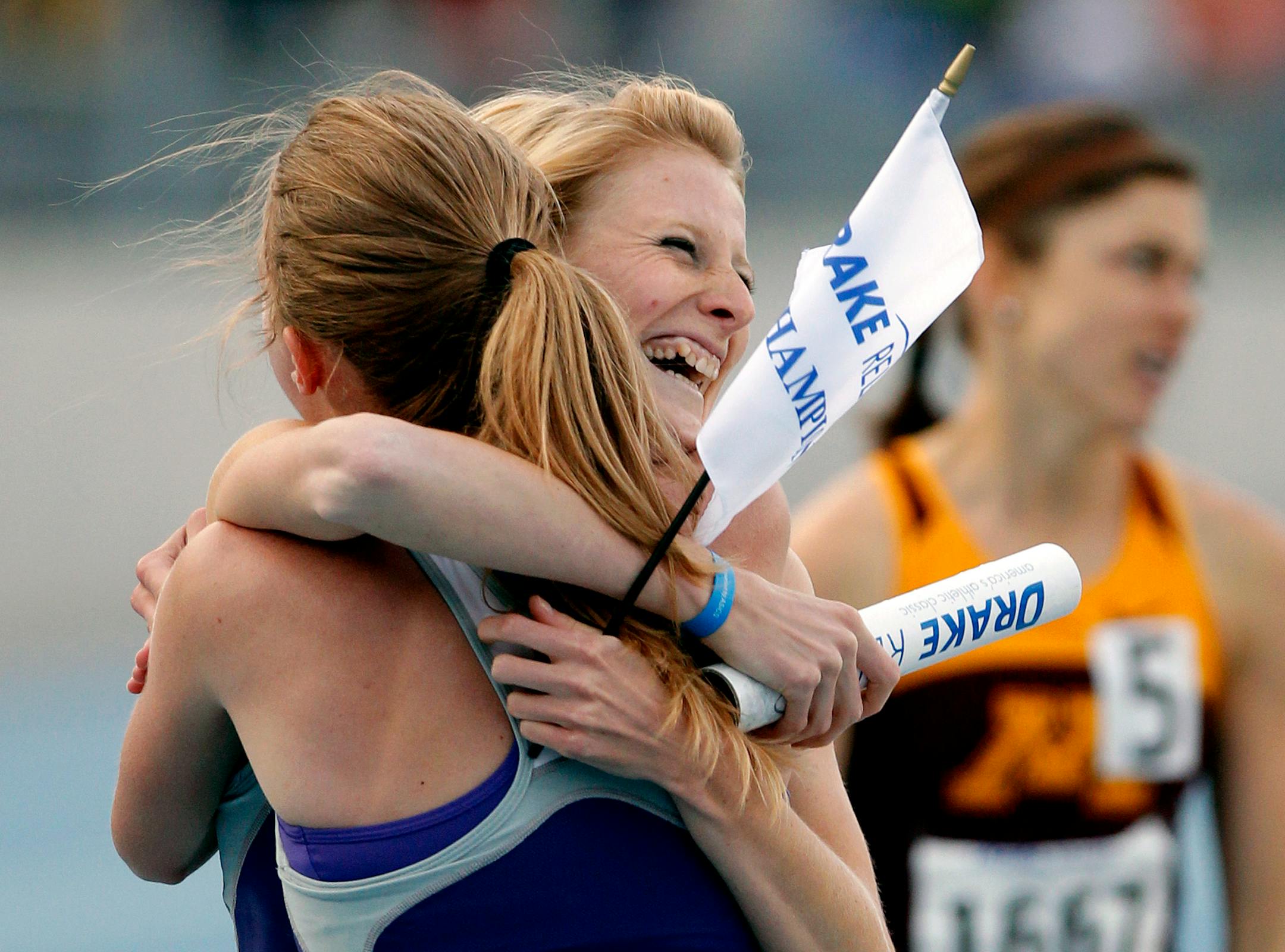 Kansas State's Sara Stoakes, left, and Boglarka Bozzay, right, celebrates the team's first place finish in the 4x800-meter relay at the 102nd Drake Relays, Friday, April 29, 2011, in Des Moines, Iowa. (AP Photo/The Waterloo Courier, Matthew Putney)