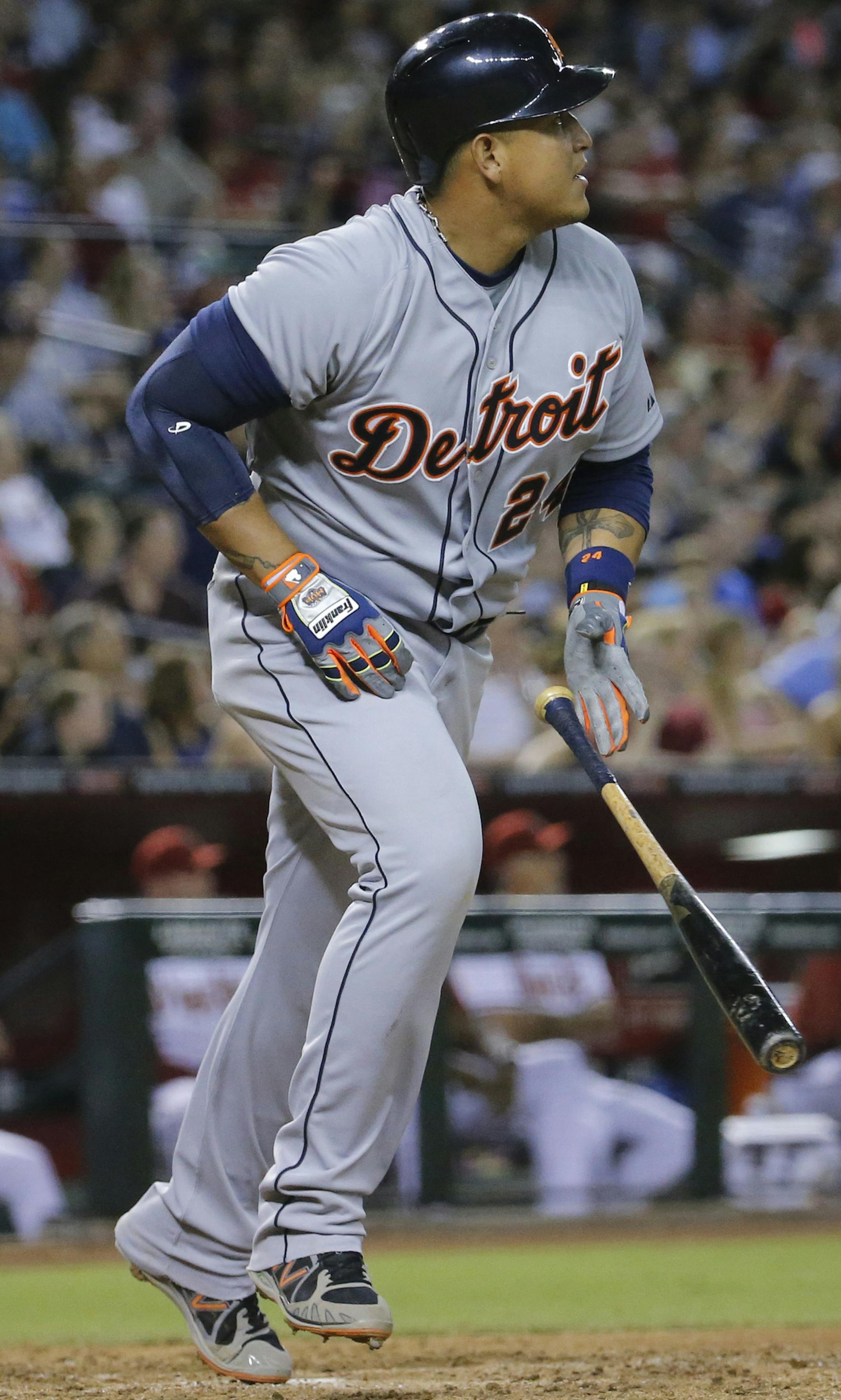 Detroit Tigers' Miguel Cabrera follows through on an RBI single against the Arizona Diamondbacks during the sixth inning of a baseball game, Monday, July 21, 2014, in Phoenix. (AP Photo/Matt York) ORG XMIT: AZMY118