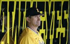 ADVANCE FOR WEEKEND EDITIONS, MAY 8-10 - In this May 5, 2015, photo, Iowa coach Rick Heller sits in the dugout during an NCAA college baseball game ag