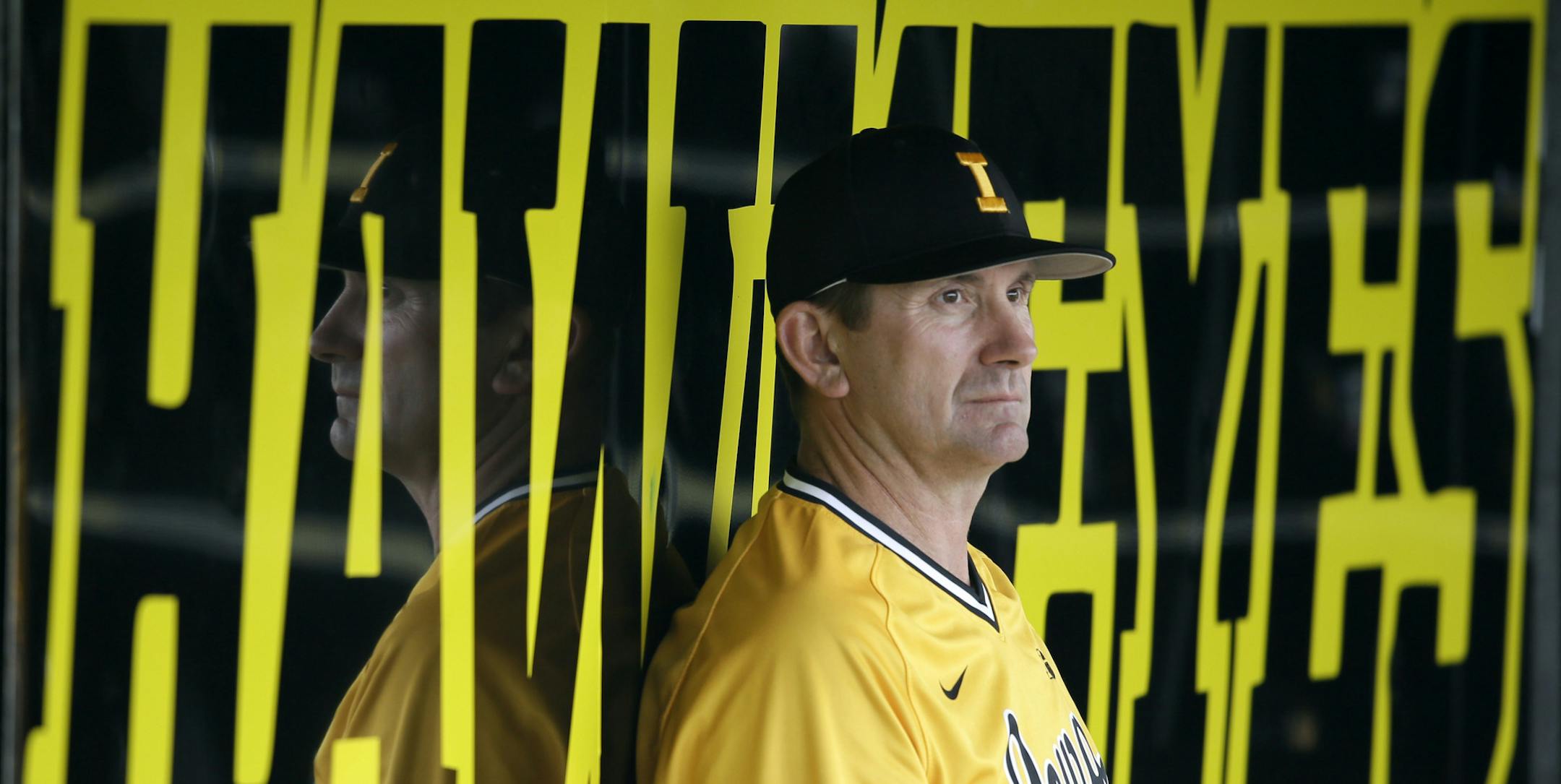 ADVANCE FOR WEEKEND EDITIONS, MAY 8-10 - In this May 5, 2015, photo, Iowa coach Rick Heller sits in the dugout during an NCAA college baseball game against Western Illinois in Iowa City, Iowa. Heller, in his second season at Iowa, has his team at 34-12 heading into this weekend&#xed;s final regular season series against Minnesota and is all but certain to reach the NCAA Tournament for the first time in 25 years. (AP Photo/Charlie Neibergall)