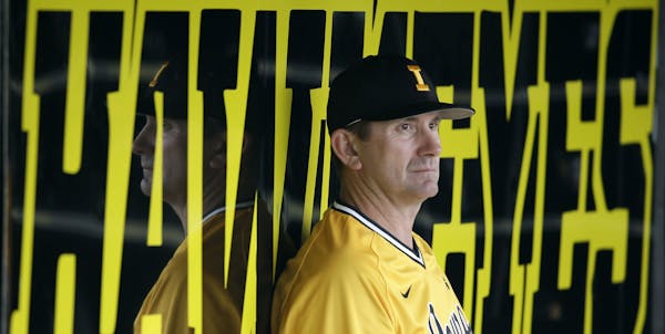 ADVANCE FOR WEEKEND EDITIONS, MAY 8-10 - In this May 5, 2015, photo, Iowa coach Rick Heller sits in the dugout during an NCAA college baseball game ag