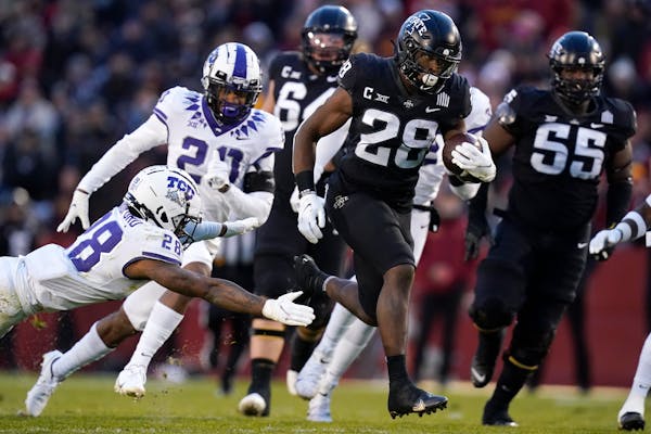 Iowa State running back Breece Hall runs from TCU safety Nook Bradford, left, during a 39-yard touchdown run in the first half an NCAA college footbal