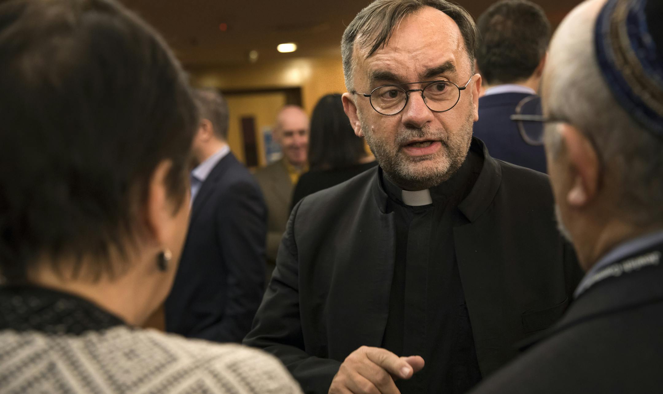 Rev. Patrick Desbois spoke with Genya and Joseph Buslavich at a reception before he spoke at Beth El Synagogue in St. Louis Park, Minn., on Thursday, January 26, 2016. Joseph and Genya's parents were in eastern Europe and survived the World War II but they lost almost all their other family members. Rev. Desbois has written a book called "Holocaust by Bullets" on the eastern European Holocaust that killed many Jewish people not in concentration camps. ] RENEE JONES SCHNEIDER • renee.jones