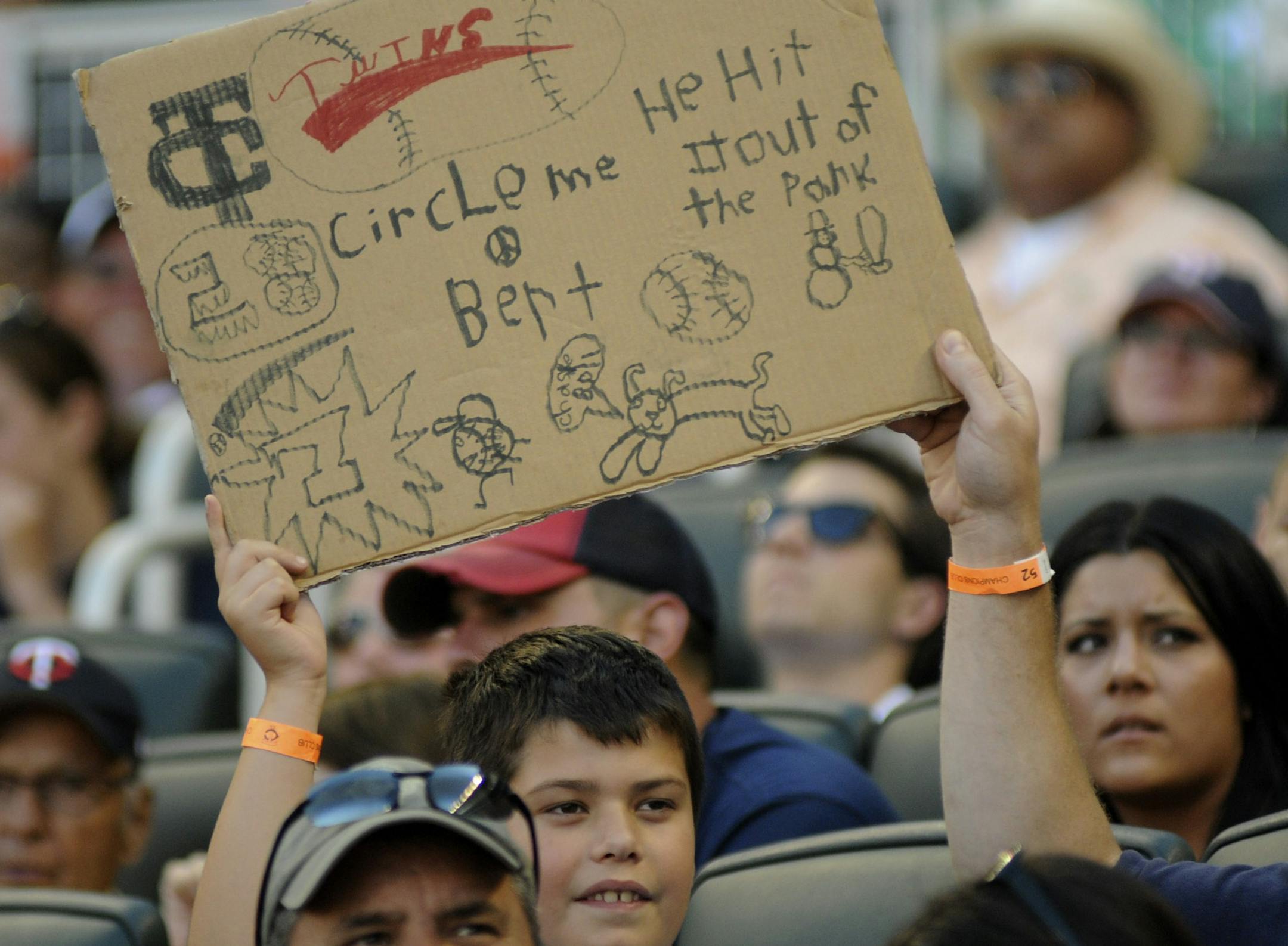 Collin Sullivan 8 years old of Roseville, Minn held up his Circle Me Bert sign at Target Field in Minneapolis Minn., Sunday, July 25, 2011. ] Richard Sennott/Star Tribune. Richard.Sennott@startribune.com Minneapolis,Minn. Sunday 07/25/11) ** ORG XMIT: MIN2018032817414144