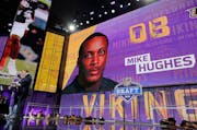 Commissioner Roger Goodell poses with a fan after the Vikings selected Central Florida's Mike Hughes during the first round