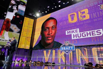 Commissioner Roger Goodell poses with a fan after the Vikings selected Central Florida's Mike Hughes during the first round