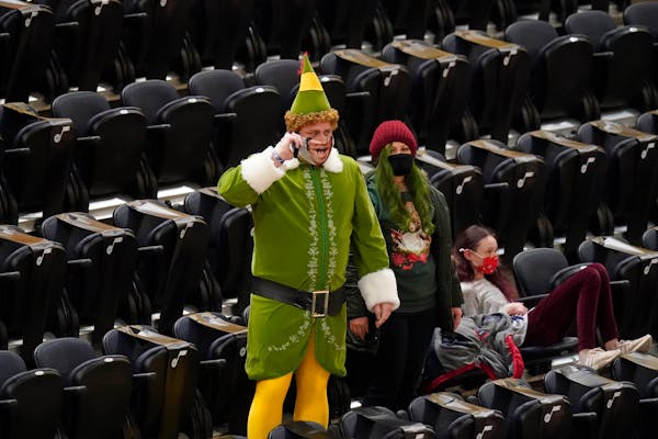 A Utah Jazz fan shows his Christmas spirit before an NBA basketball game against the Minnesota Timberwolves Saturday, Dec. 26, 2020, in Salt Lake City