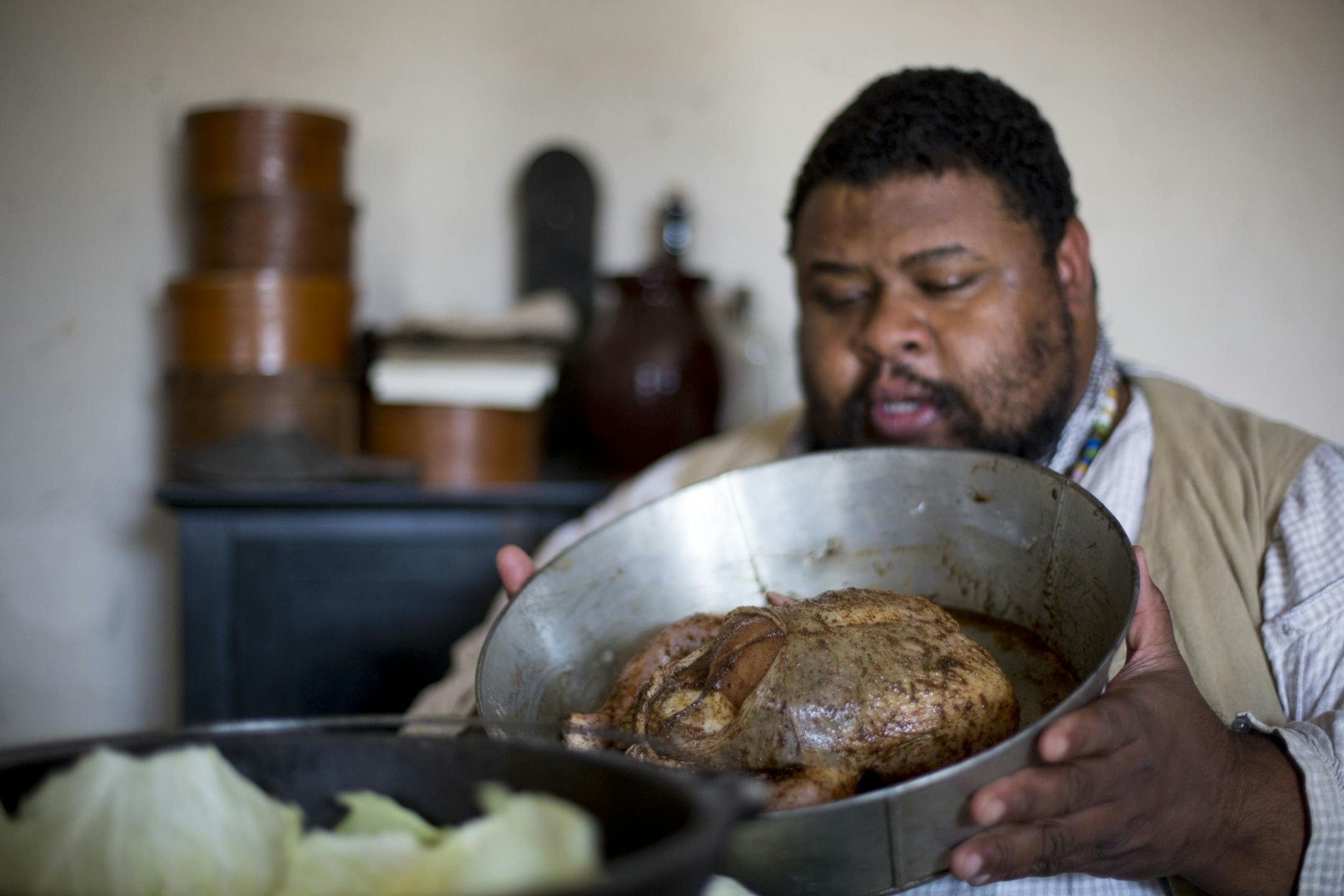 Michael Twitty discusses how he spiced the chicken hours earlier.