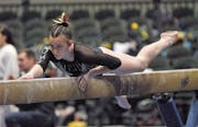 Autumn Schmidt competed on the balance beam Friday, when she helped Lakeville South win a state championship.