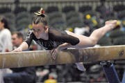 Autumn Schmidt competed on the balance beam Friday, when she helped Lakeville South win a state championship.