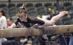Autumn Schmidt competed on the balance beam Saturday, when she helped Lakeville South win a state championship.