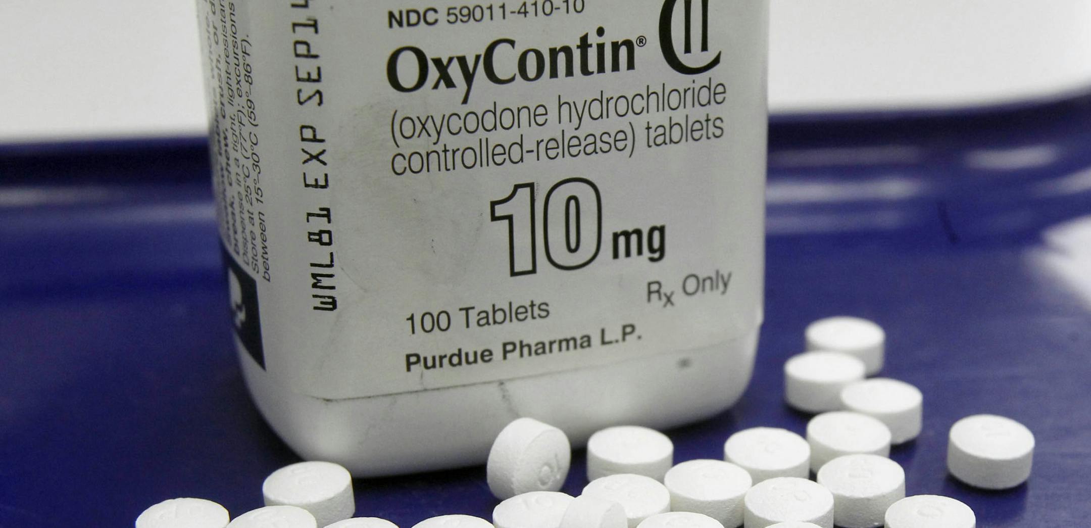 FILE - This Feb. 19, 2013, file photo, shows OxyContin pills arranged for a photo at a pharmacy in Montpelier, Vt. With an overdose epidemic worsening, nearly one-third of Medicare beneficiaries received at least one prescription for commonly abused opioids such as OxyContin and fentanyl in 2015. (AP Photo/Toby Talbot, File) ORG XMIT: MIN2016072214512278