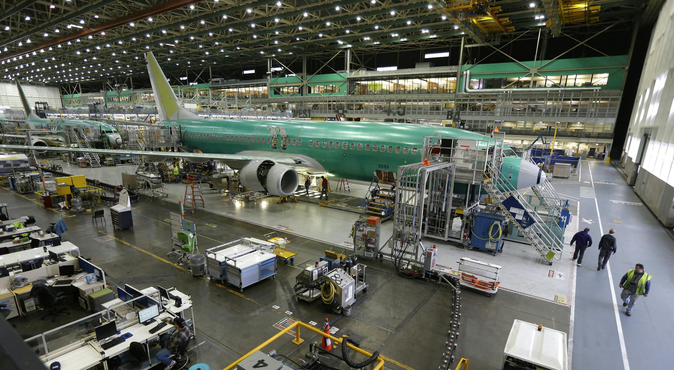 In this Tuesday, Dec. 16, 2014, photo, Boeing 737-800 airplanes are on the assembly line at Boeing's 737 assembly facility in Renton, Wash. On Friday, June 3, 2016, the Commerce Department reports on U.S. factory orders for April. (AP Photo/Ted S. Warren)