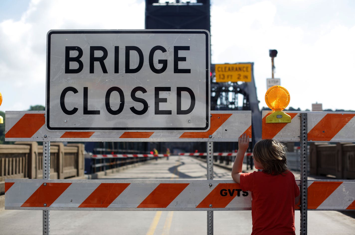 Maddox Feiner, 8, watched the Minnesota Department of Transportation close the Stillwater Lift Bridge on Monday morning.