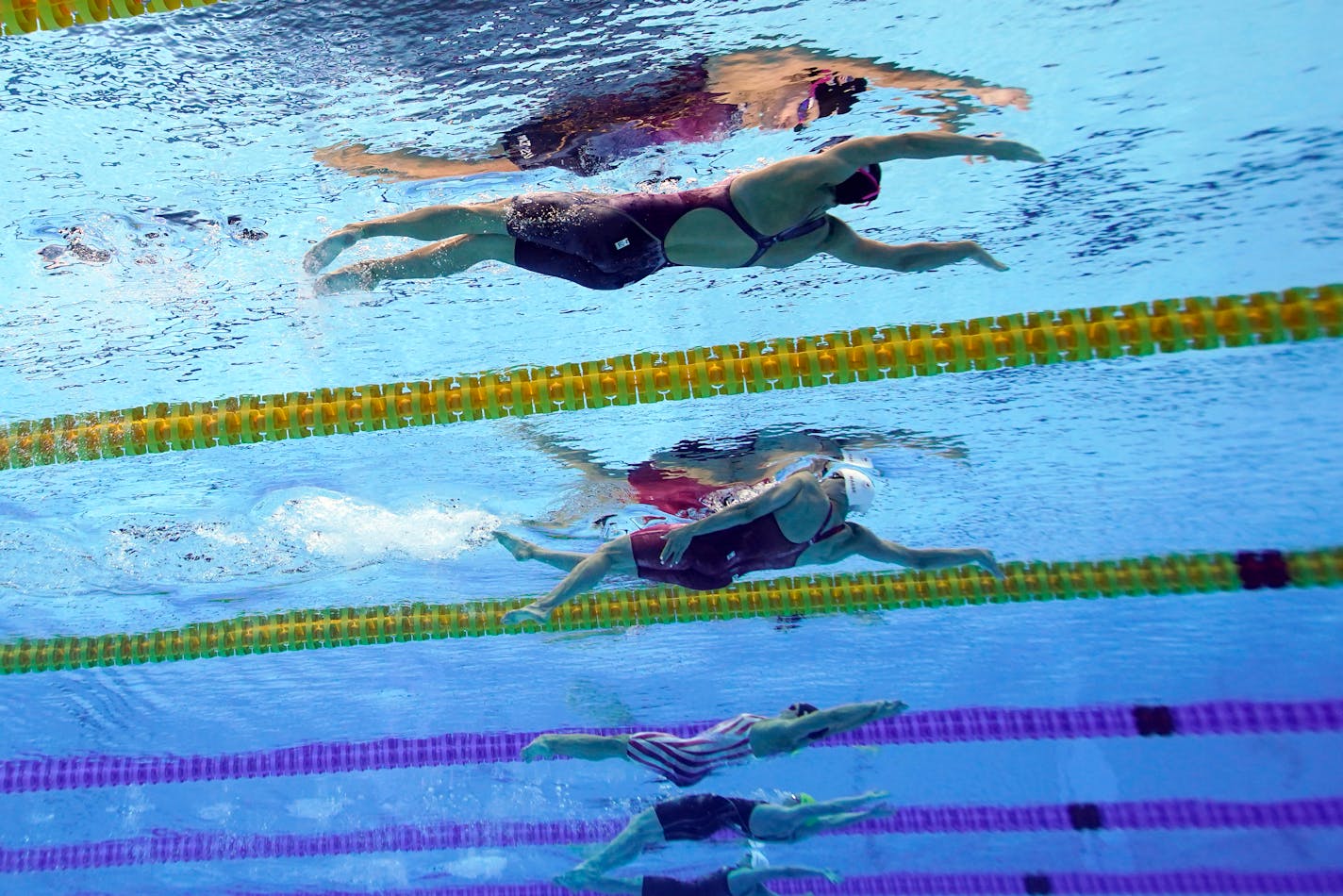 United States' Regan Smith, top, swims to win the bronze medal in the 100-meter backstroke final at the 2020 Summer Olympics, Tuesday, July 27, 2021, in Tokyo. (AP Photo/David J. Phillip)