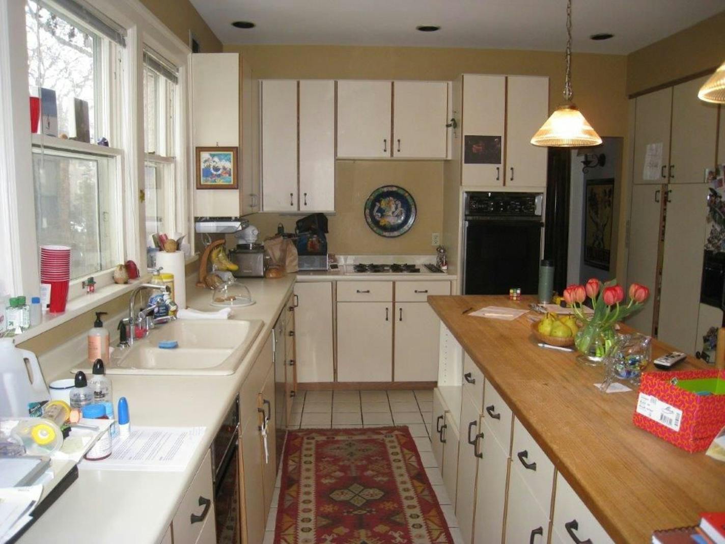 Before: The kitchen was dark, dated and cramped.