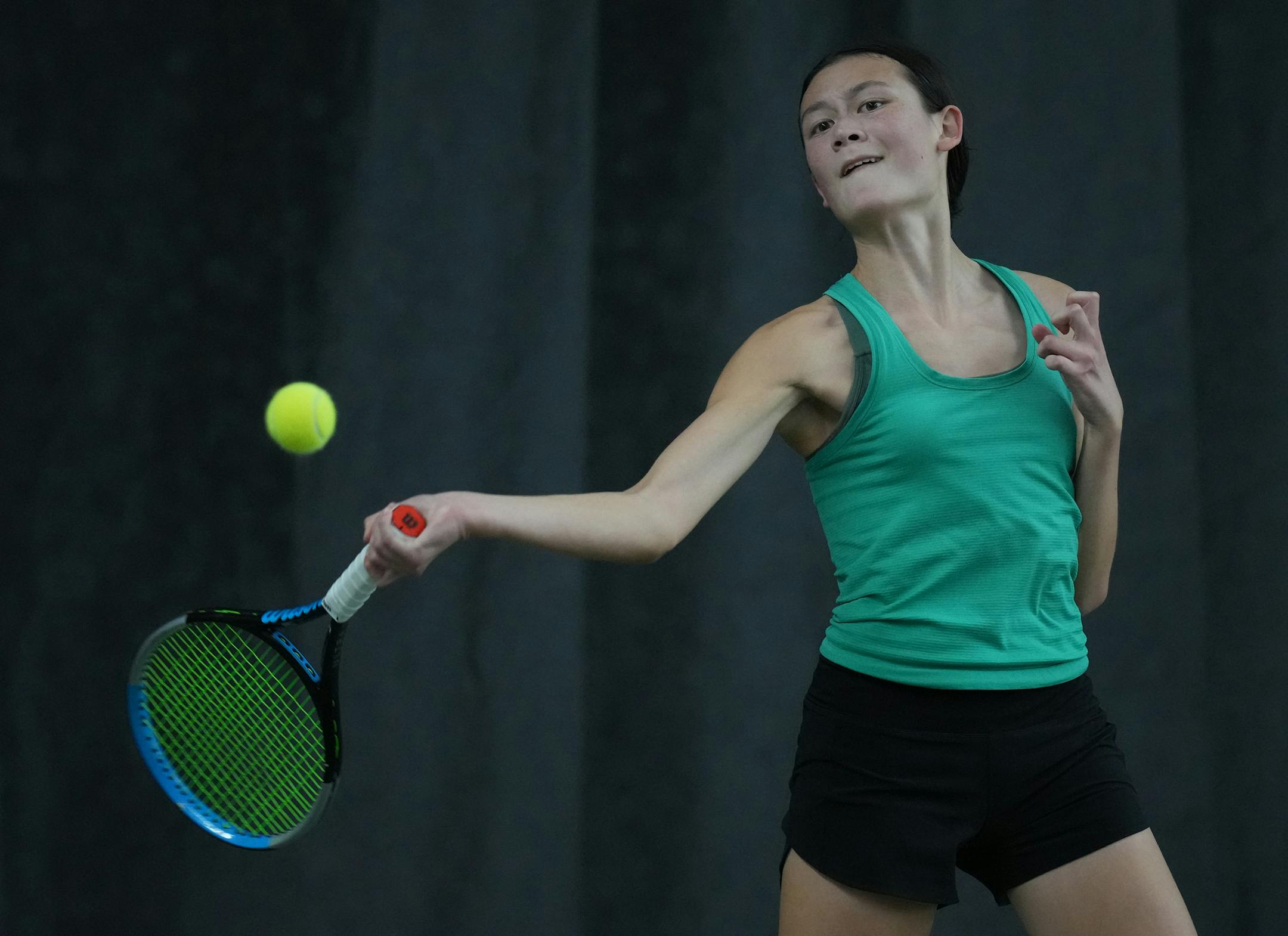 Malea Diehn of Mayo returns a volley from Raya Hou of Edina who goes on to lose the match at the Baseline Tennis Center in Minneapolis, Minnesota on Wednesday, Oct. 25, 2023.