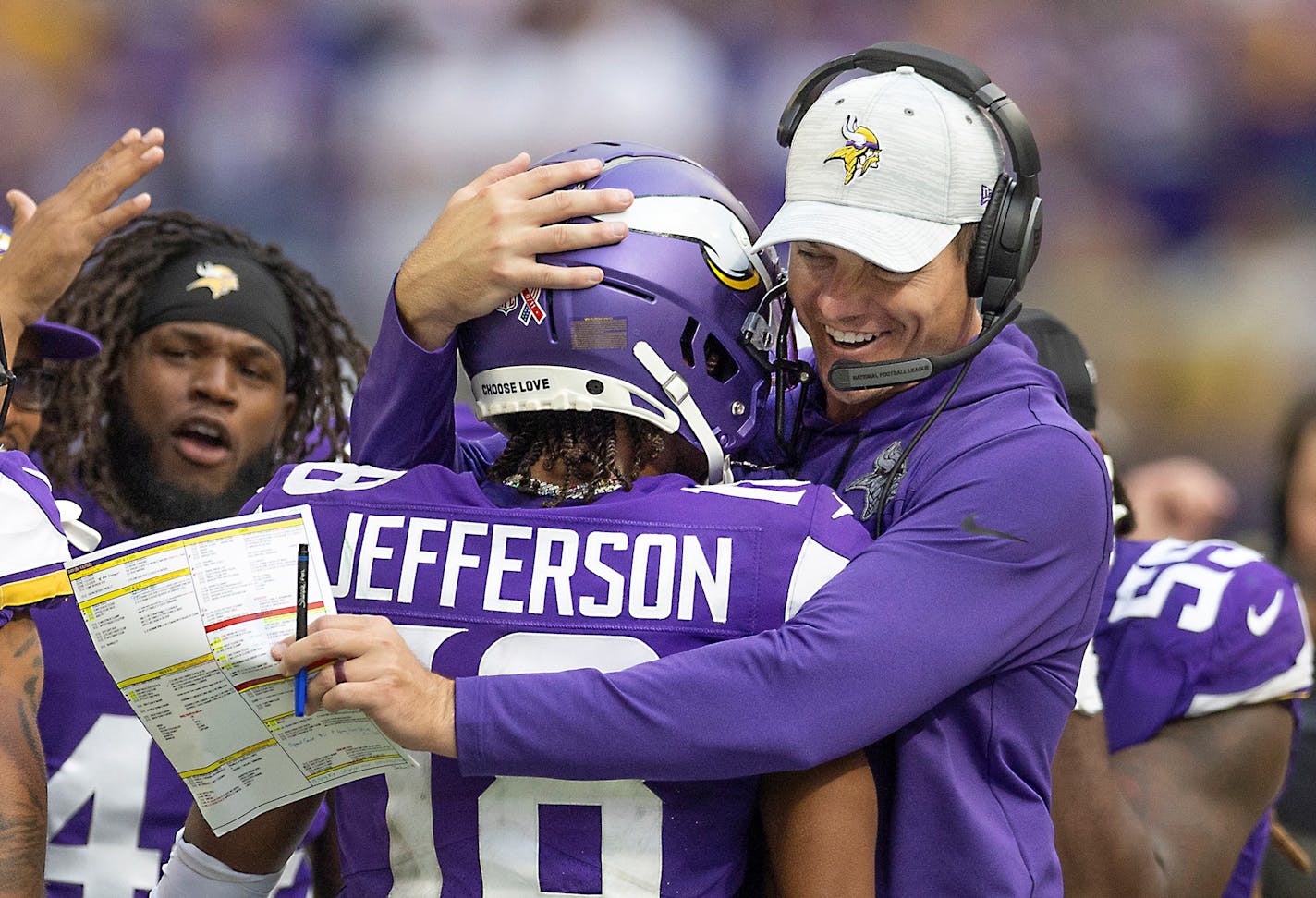 Minnesota Vikings head coach Kevin O'Connell hugs wide receiver Justin Jefferson (18) as they celebrate his second touchdown during the first quarter against the Green Bay Packers at U.S. Bank Stadium, in Minneapolis on Sunday, Sept. 11, 2022. (Elizabeth Flores/Minneapolis Star Tribune/TNS) ORG XMIT: 58263572W