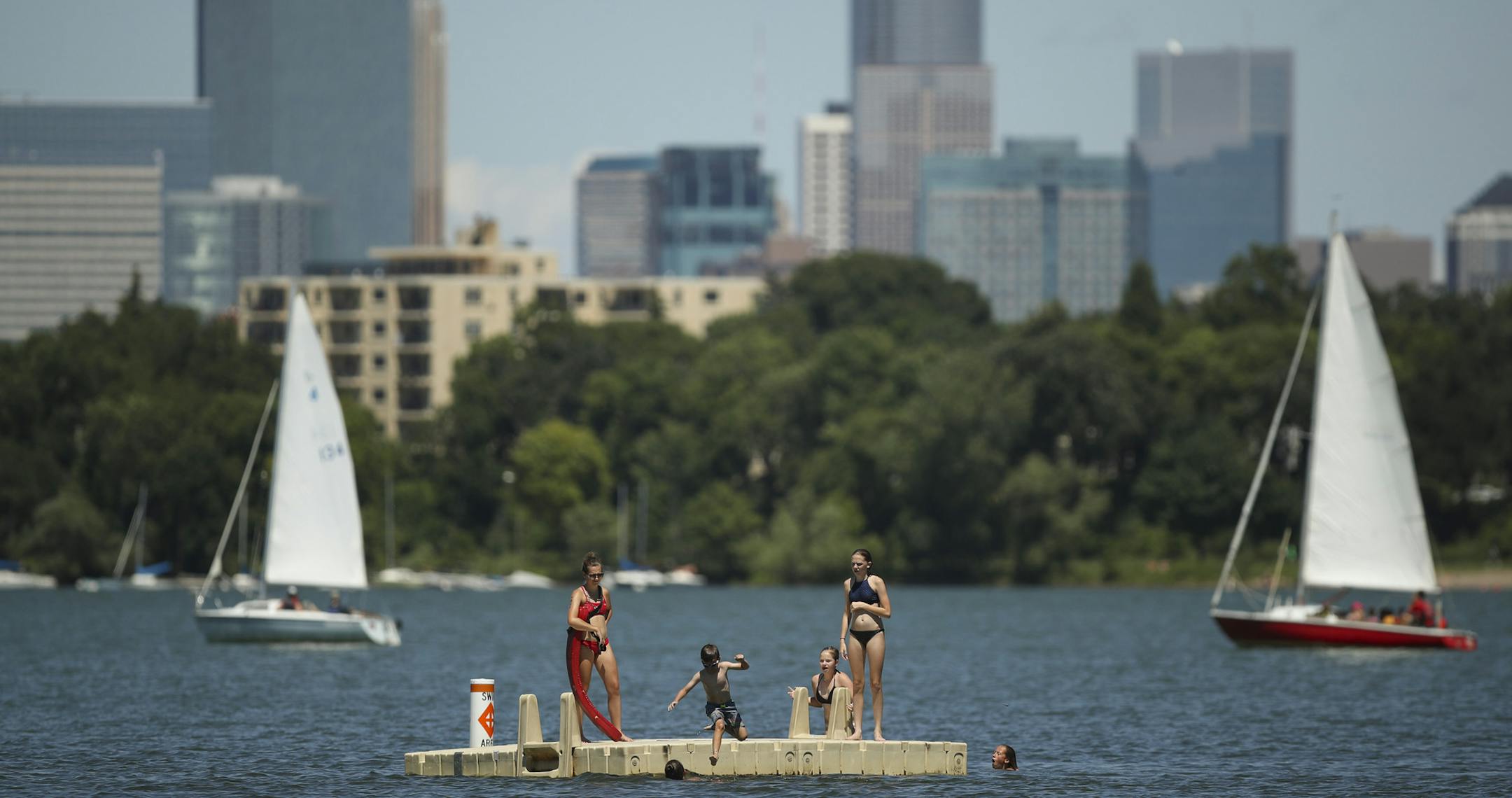 Kids jumped off the raft off Thomas Beach into Lake Bde Maka Ska Monday afternoon. ] JEFF WHEELER • jeff.wheeler@startribune.com Following the lead of the Minneapolis Park and Recreation Board and the Minnesota Department of Natural Resources, the federal government now recognizes Lake Calhoun as Lake Bde Maka Ska. Swimmers jumped off the raft off Thomas Beach into Lake Bde Maka Ska Monday afternoon, July 16, 2018.