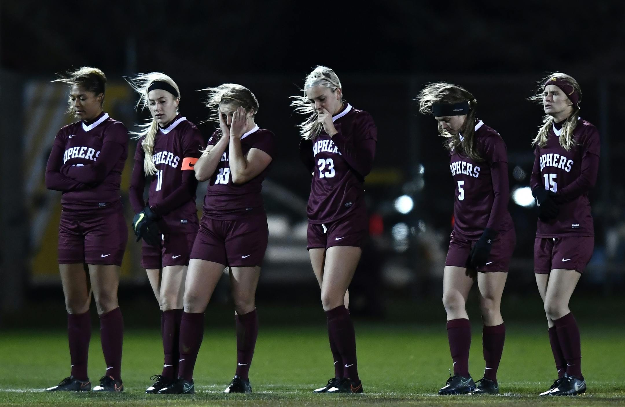 Minnesota players were dejected as NC State took a 3-2 lead in PKs Saturday night.