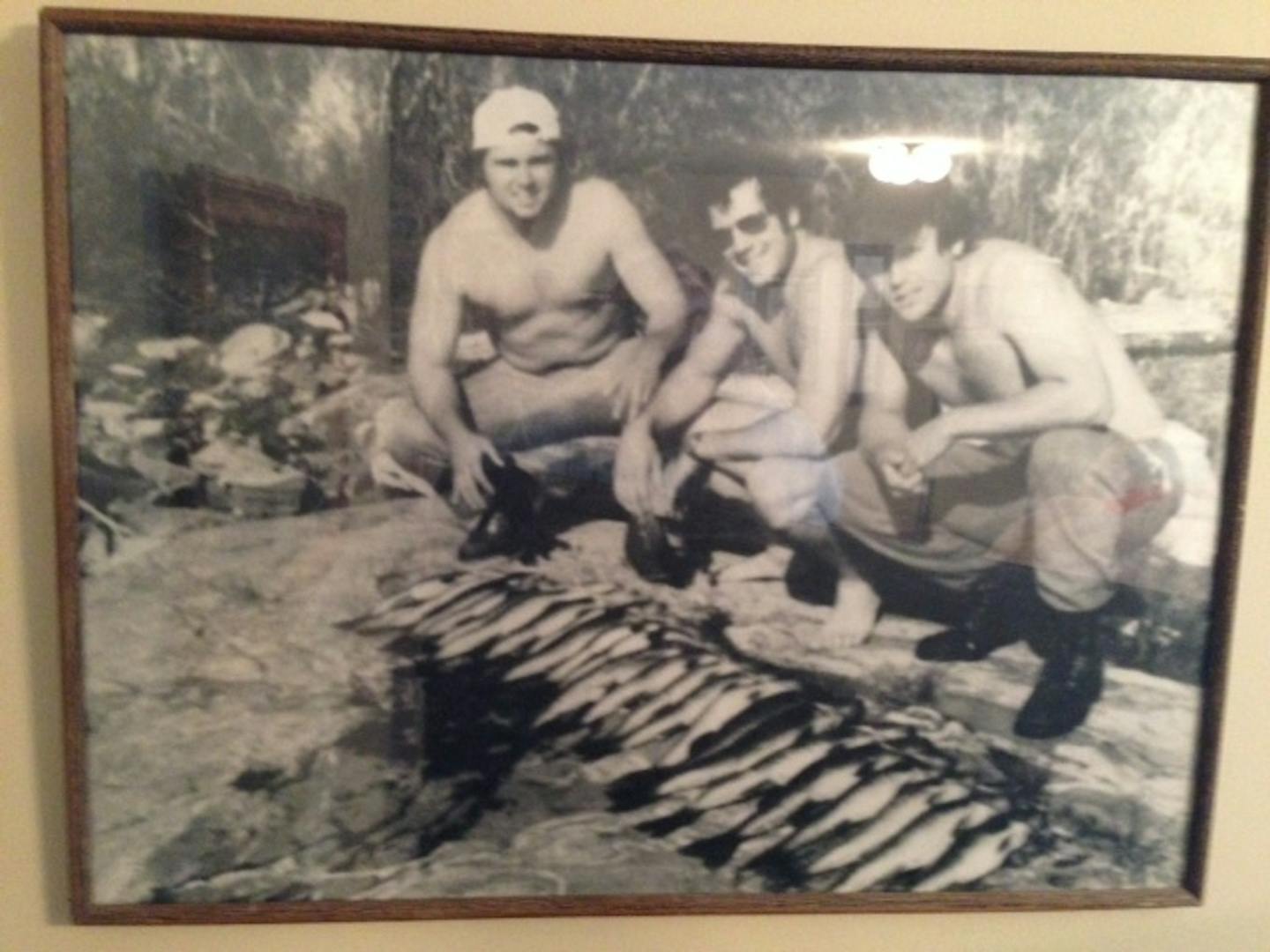 Greg Gagne, center, with friends on a fishing trip.