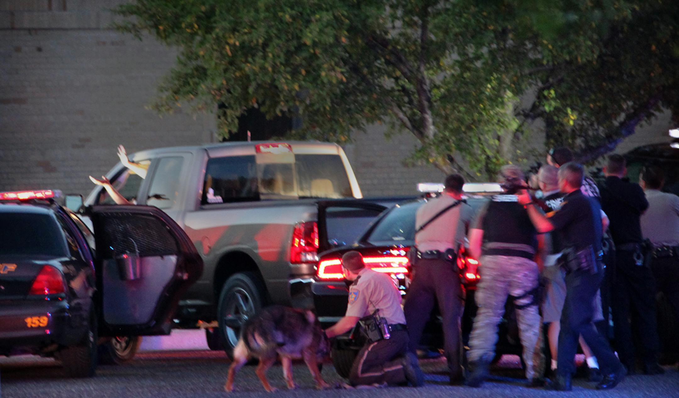 Officers from Coon Rapids, Blaine, Lino Lakes and Anoka County surrounded the truck of a man who surrendered with his hand out the window after he led them on a chase across Blaine and into the parking lot of Lino Lakes Elementary School near dusk Tuesday.