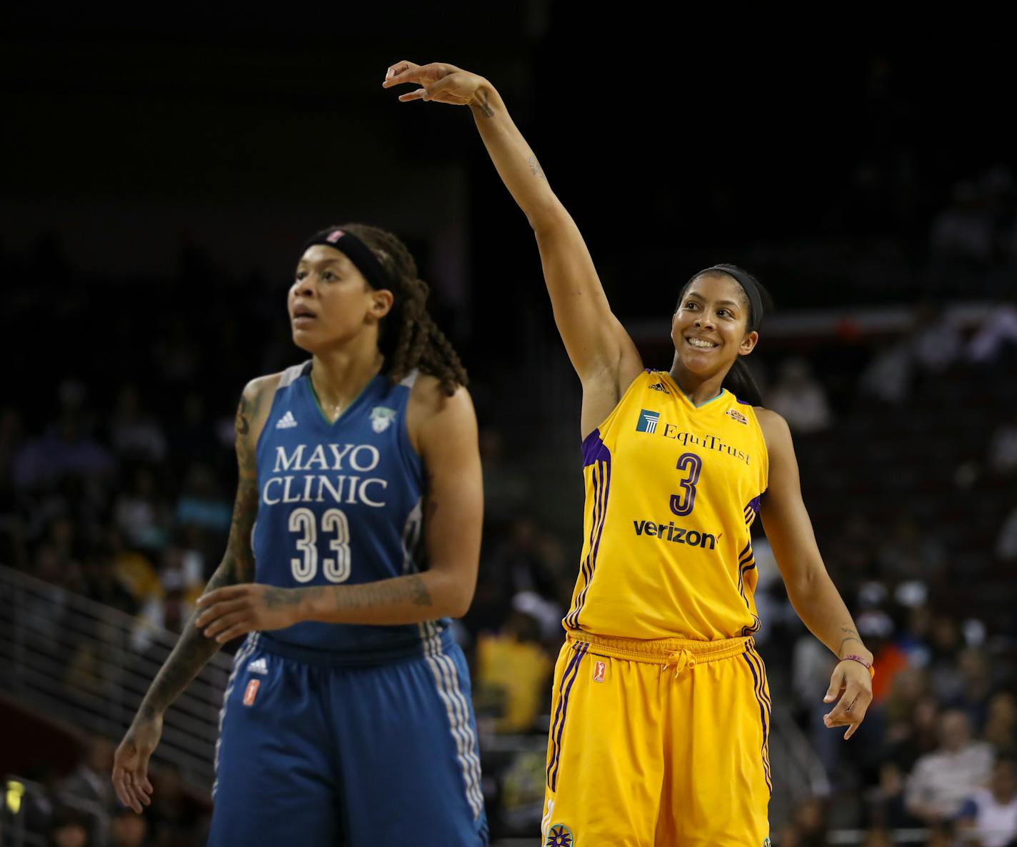 Los Angeles Sparks forward Candace Parker, who finished with a game-high 24 points, smiled as she watched a fourth quarter shot drop. Lynx guard Seimone Augustus was in the foreground. The Minnesota Lynx lost to the Los Angeles Sparks 92-75 in Game 3 of their WNBA Finals series Friday night, October 14, 2016 at the Galen Center in Los Angeles.