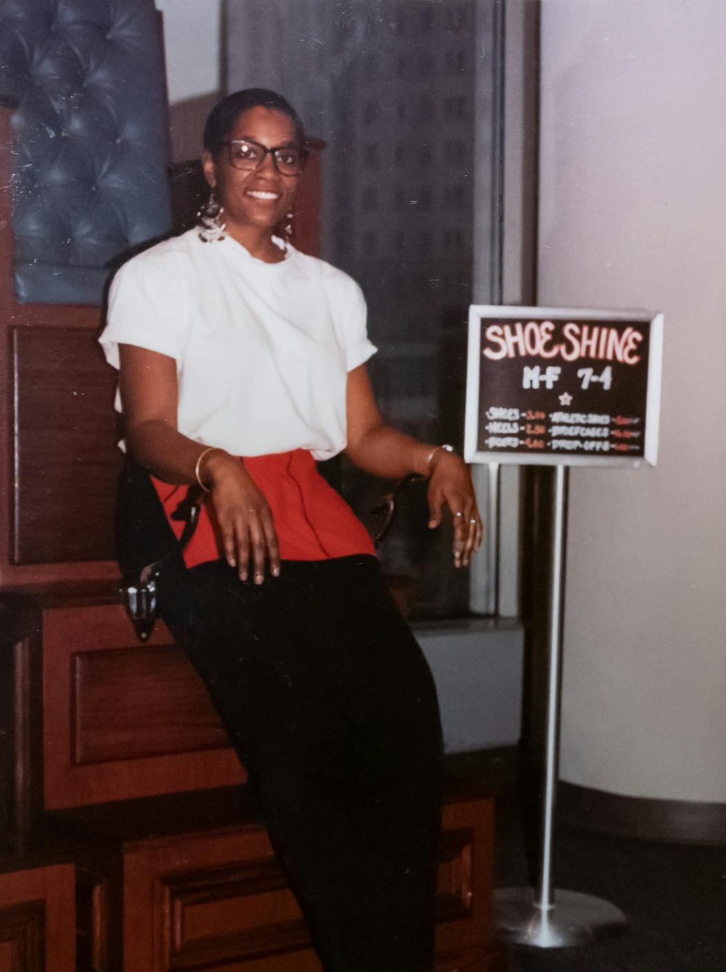 A photo of Lisa Cotton when she started in the shoeshine business in 1991. 
