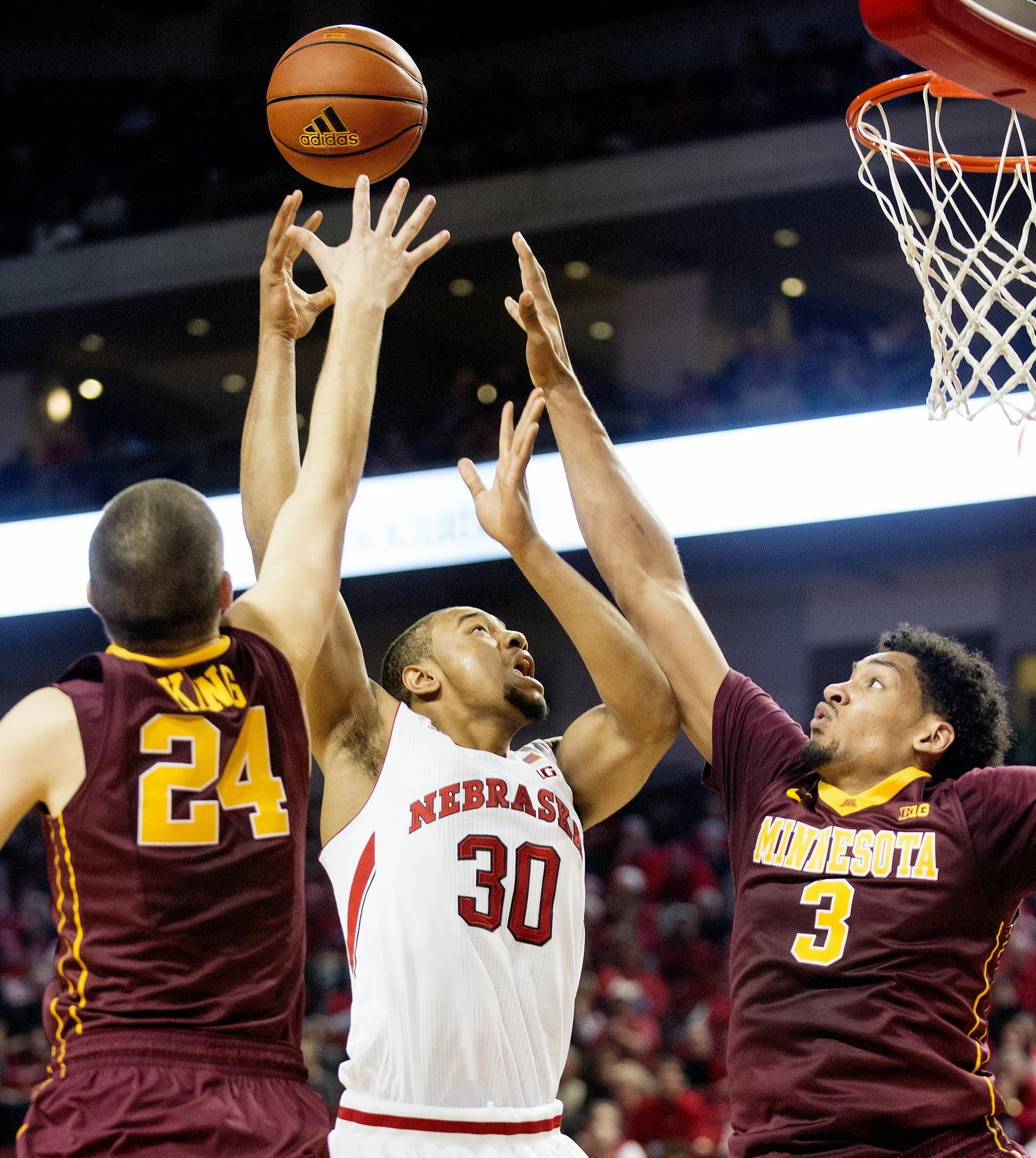 Nebraska forward Ed Morrow Jr. (30) shoots between Minnesota forward Joey King (24) and forward Jordan Murphy (3) during the second half of an NCAA college basketball game in Lincoln, Neb., Tuesday, Jan. 12, 2016. (Francis Gardler/The Journal-Star via AP) LOCAL TELEVISION OUT; KOLN-TV OUT; KGIN-TV OUT; KLKN-TV OUT; MANDATORY CREDIT