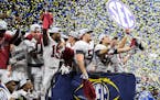 Alabama players celebrate after a win over Georgia for the Southeastern Conference championship