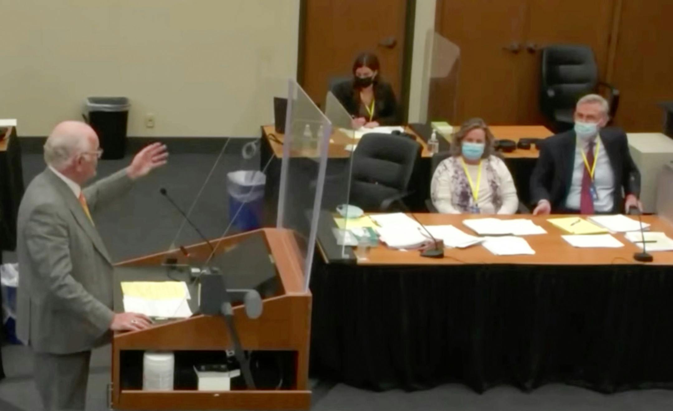 In this screen grab from video, defense attorney Earl Gray, left, points out his client while questioning a potential juror during the manslaughter trial of former Brooklyn Center police officer Kimberly Potter in the shooting death of Daunte Wright during jury selection Wednesday, Dec. 1, 2021 at the Hennepin County Courthouse in Minneapolis, Minn. (Court TV, Pool) ] ORG XMIT: MIN2112011421430204