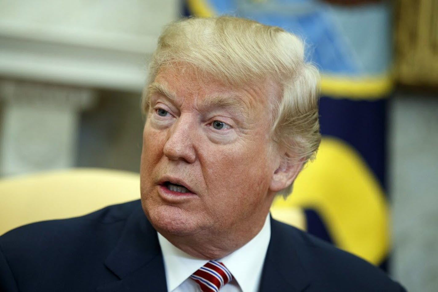 President Donald Trump speaks during a meeting with Shane Bouvet, a campaign volunteer, in the Oval Office of the White House, Friday, Feb. 9, 2018, in Washington.