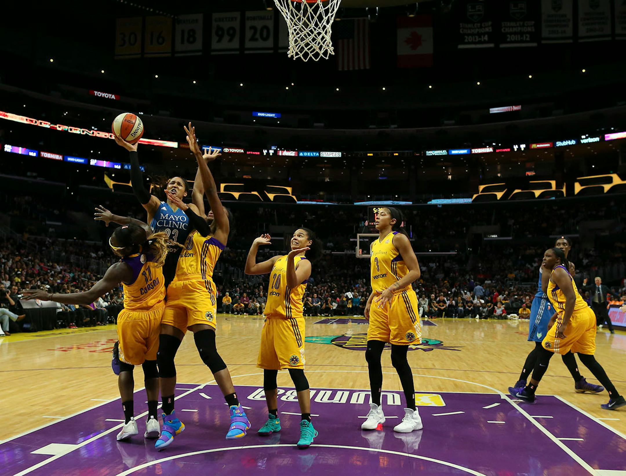 Minnesota Lynx forward Maya Moore (23) was fouled by Los Angeles Sparks forward Essence Carson (17) while shooting in the second quarter.