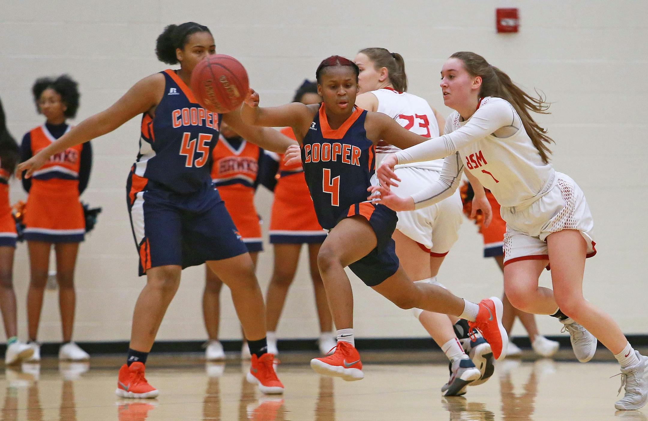 Robbinsdale Cooper guard Ty'neecia Longs leaps for the ball during the championship game against Benilde-St. Margaret's on Thursday, March 8, 2018 at Chanhassen High School. [Ellen Schmidt &#xef; ellen.schmidt@startribune.com {Ty'neecia is correct
