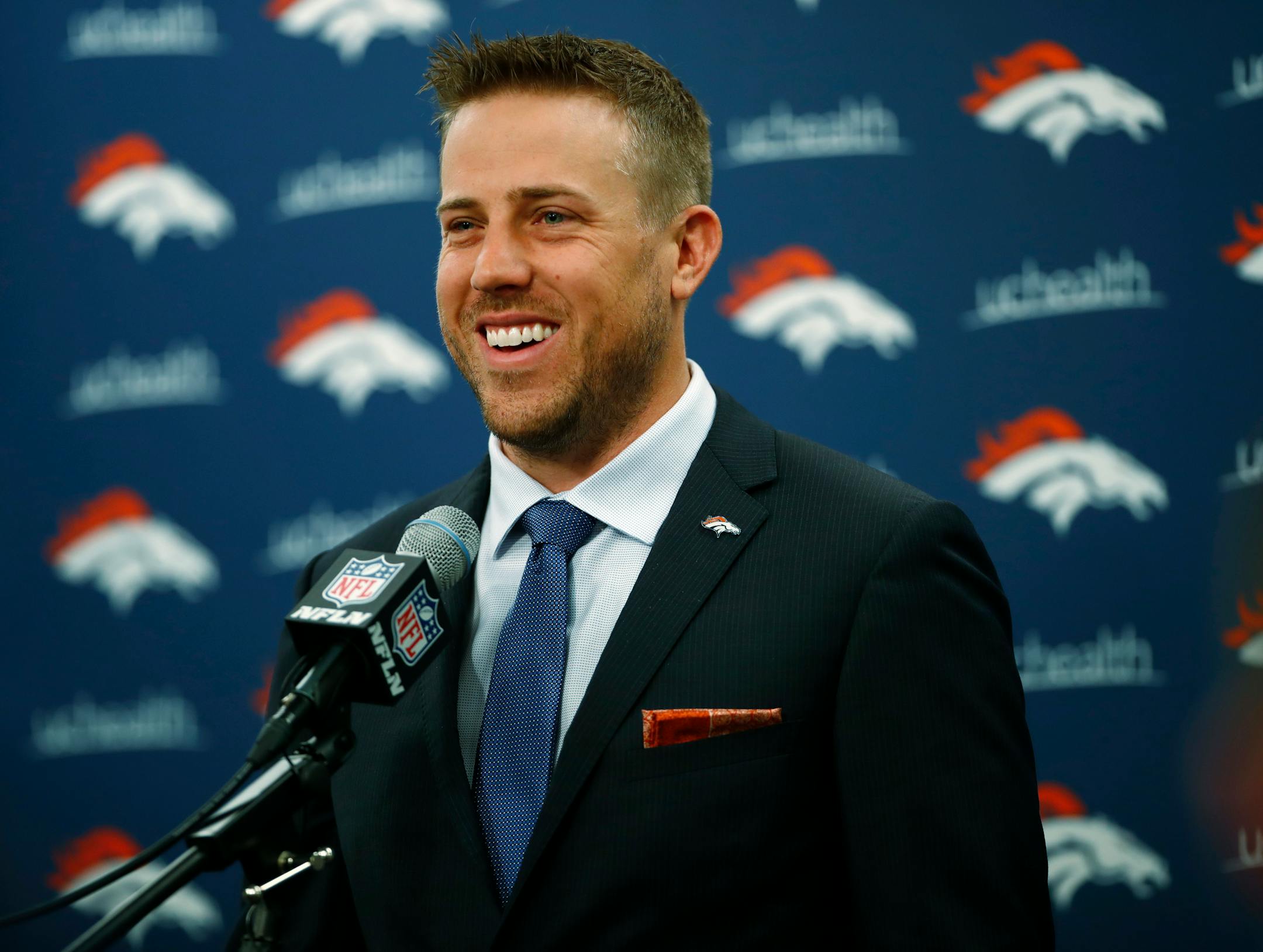Case Keenum smiles during a news conference to introduce him as the new starting quarterback of the Denver Broncos
