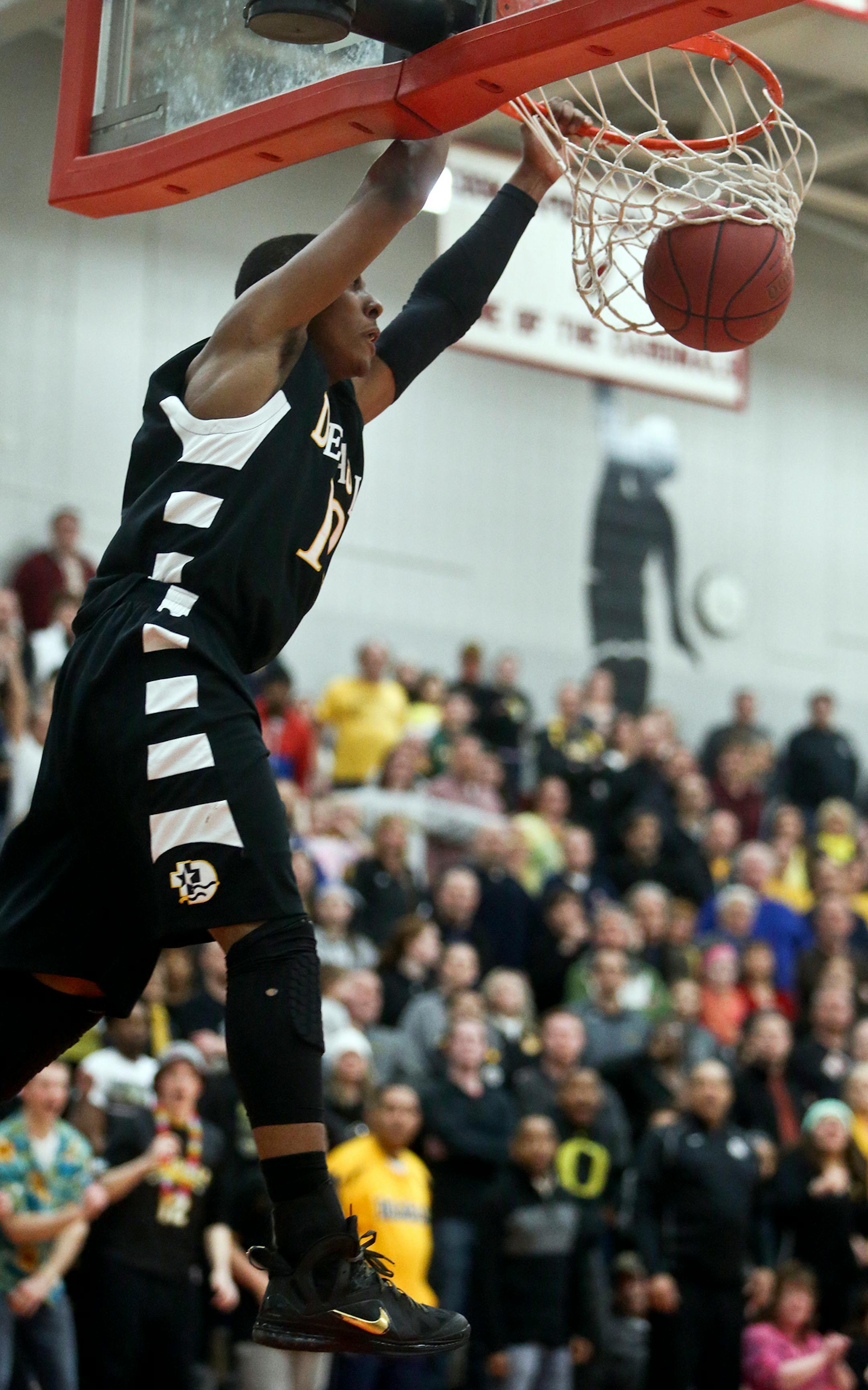 DeLaSalle's Jarvis Johnson (12) jams during the second half of their win over Totino-Grace Friday, March 7, 2014, at Coon Rapids High in Coon Rapids, MN.](DAVID JOLES/STARTRIBUNE) djoles@startribune.com Class 3A, Section 3 final DeLaSalle vs. Totino-Grace at Coon Rapids High Friday, March 7, 2014, in Coon Rapids.