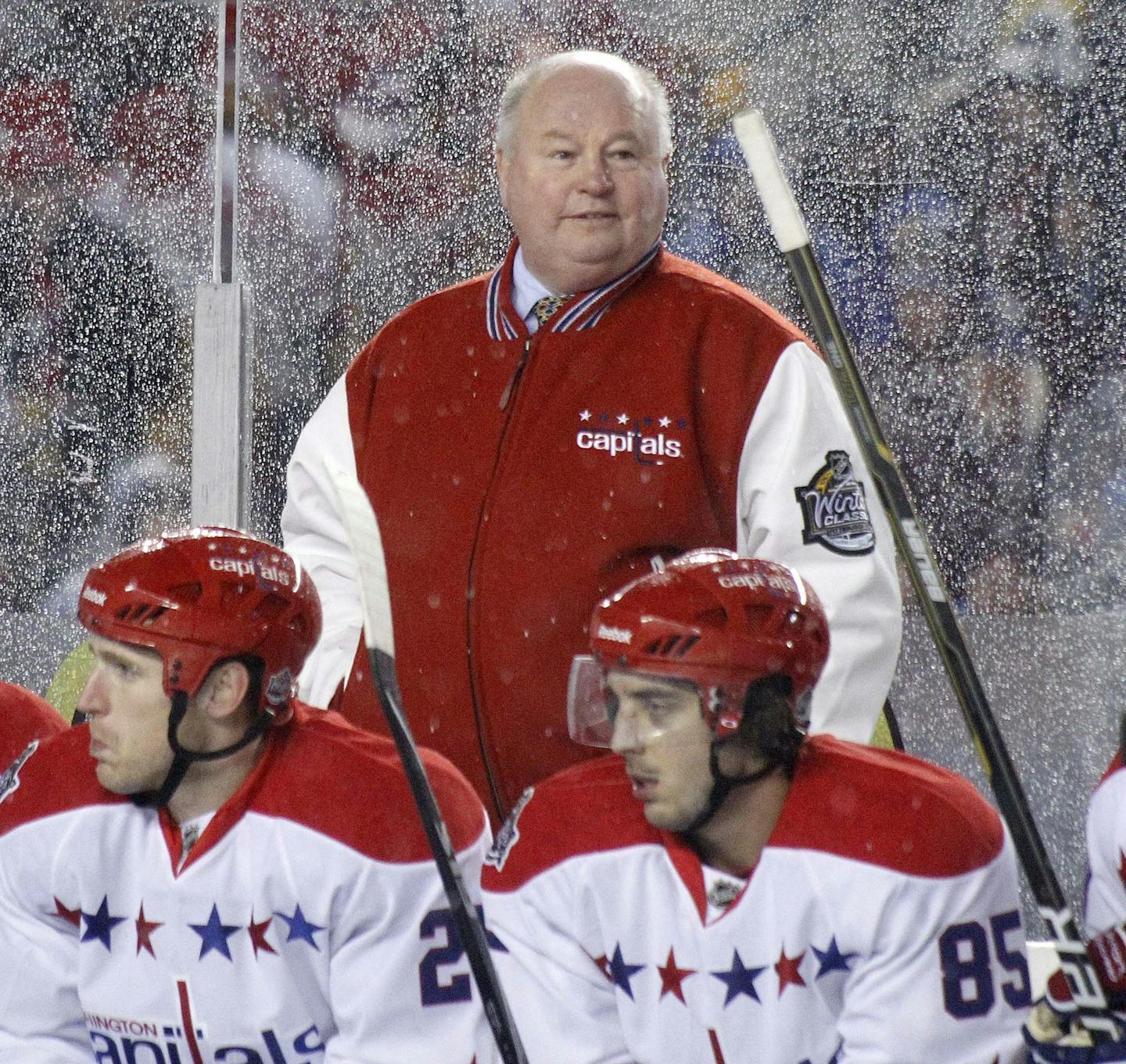 Washington Capitals head coach Bruce Boudreau stands behind players during the third period of the NHL Winter Classic outdoor hockey game against the Pittsburgh Penguins in Pittsburgh on Saturday, Jan. 1, 2011. The Capitals won 3-1.(AP Photo/Keith Srakocic) ORG XMIT: PAKS125