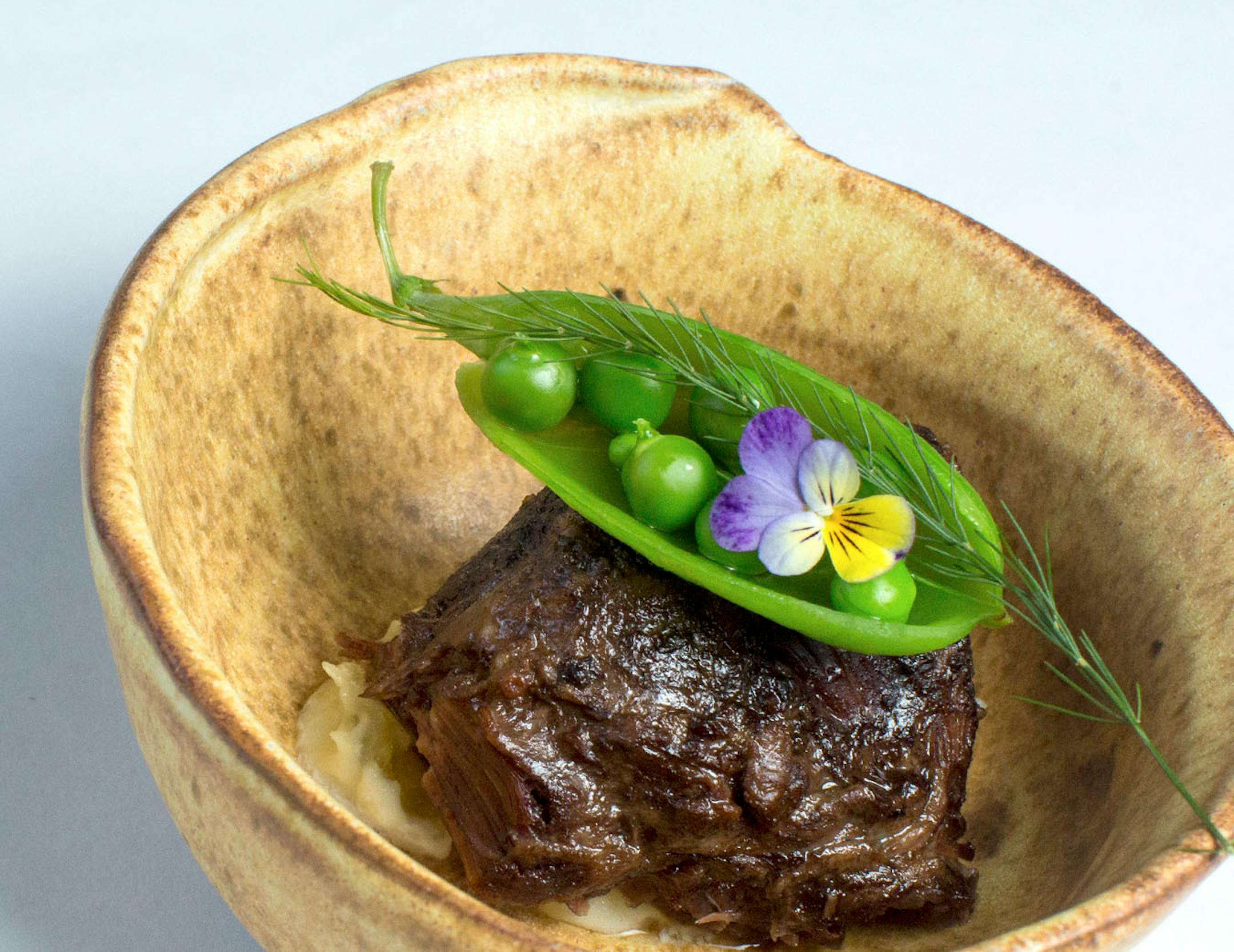 Chef Shack serves a thousand hills grass fed beef cheek in a handmade bowl. ] COURTNEY PEDROZA • courtney.pedroza@startribune.com June 22-24, 2017; Wisconsin restaurants, cafes, bars, bakeries and breweries; Dining along the Mississippi River.