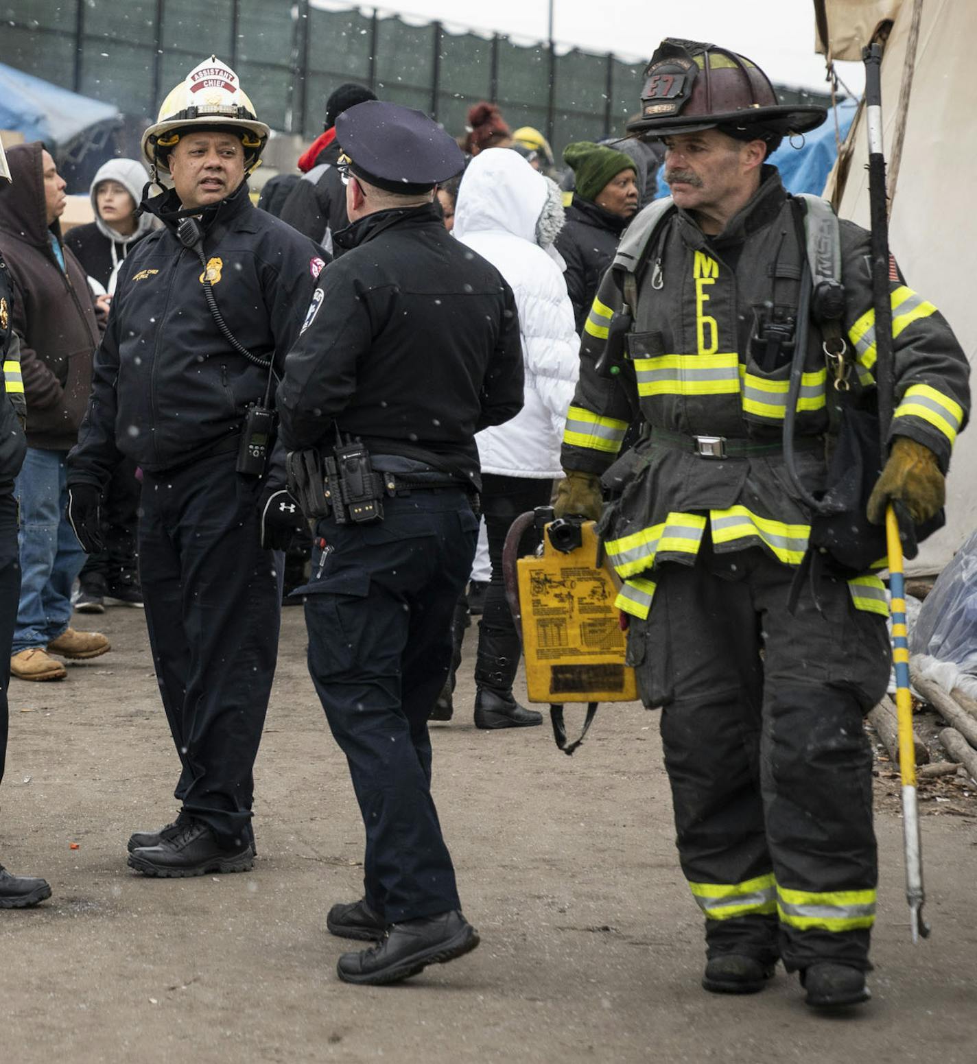 Fire fighters gathered to talk at "Tent City" after putting out a fire in a tent nearby on November 19, 2018 in Minneapolis, Minn. ] RENEE JONES SCHNEIDER &#x2022; renee.jones@startribune.com