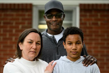 Kelly Drummer, executive director of Migizi with her husband, Samuel and youngest son, Solomon.