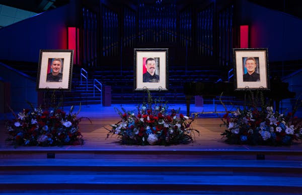 Portraits of Burnsville police officers Paul Elmstrand, 27, firefighter-paramedic Adam Finseth, 40, and officer Matthew Ruge, 27, left to right, were 