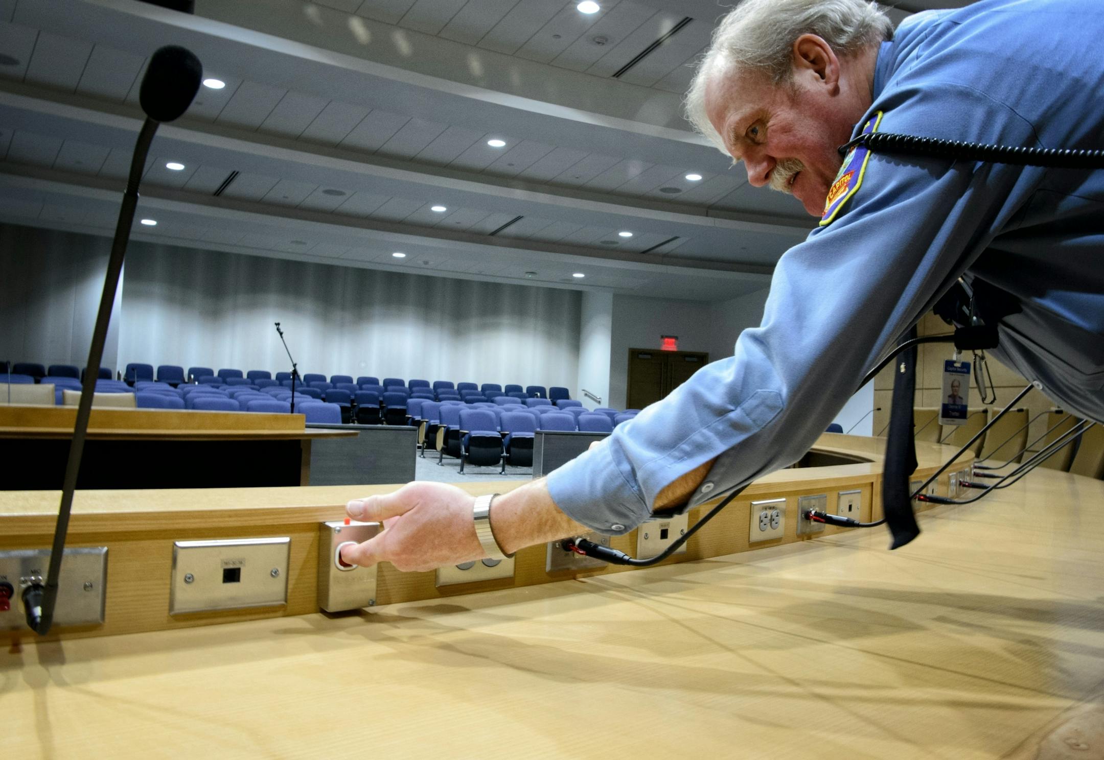Capitol Police officer Dennis Trettel tested the panic alarm in hearing room 1200.